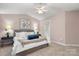 Cozy bedroom with a ceiling fan and bedside tables at 4442 Coventry Row Ct, Charlotte, NC 28270