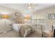 Bedroom with neutral decor featuring a floor lamp and a window at 4442 Coventry Row Ct, Charlotte, NC 28270