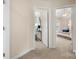 Hallway view into a spare room and a bedroom with great light at 4442 Coventry Row Ct, Charlotte, NC 28270