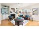 Bright living room with a cozy fireplace, built-in shelving, and stylish furnishings create a relaxing ambiance at 4442 Coventry Row Ct, Charlotte, NC 28270