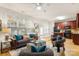 The comfortable living room leads to the kitchen with cherry cabinets and an island creating a seamless flow at 4442 Coventry Row Ct, Charlotte, NC 28270