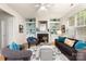 Bright living room with a cozy fireplace, built-in shelving, and stylish furnishings create a relaxing ambiance at 4442 Coventry Row Ct, Charlotte, NC 28270