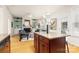 View of the spacious living room and kitchen with lots of natural light, creating a warm and inviting atmosphere at 4442 Coventry Row Ct, Charlotte, NC 28270