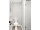 This bathroom has hard surface floors, a white toilet, and a window to let in natural light at 4601 Coronado Dr, Charlotte, NC 28212
