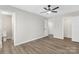 Bedroom featuring hard surface floors, a ceiling fan, an attached bathroom, and a closet at 4601 Coronado Dr, Charlotte, NC 28212