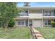 Inviting exterior of a multi-Gathering home with well-manicured lawn, walkway, and partial steps at 4601 Coronado Dr, Charlotte, NC 28212