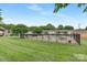 A community pool area enclosed by black fencing and green lawns, offering a serene place for recreation at 4601 Coronado Dr, Charlotte, NC 28212