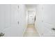 Bright hallway with luxury vinyl plank flooring leading to the front door and staircase at 4685 Mammoth Rd, Hickory, NC 28602