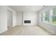Bright and spacious living room with a modern fireplace and large windows at 4685 Mammoth Rd, Hickory, NC 28602