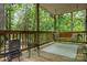 Back porch featuring ceiling and wood swing at 500 Mount Pleasant N Rd, Mount Pleasant, NC 28124