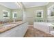 Bathroom featuring tub, vanity with dual sinks, and granite countertops at 500 Mount Pleasant N Rd, Mount Pleasant, NC 28124