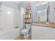 Bathroom with granite vanity and shower/tub combo at 500 Mount Pleasant N Rd, Mount Pleasant, NC 28124