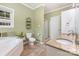 Bathroom featuring walk-in shower, tub, dual sinks, and granite countertops at 500 Mount Pleasant N Rd, Mount Pleasant, NC 28124