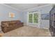Bedroom with carpet, sofa, and window at 500 Mount Pleasant N Rd, Mount Pleasant, NC 28124