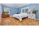 Bedroom featuring a bright window, hardwood floors, and simple decor at 500 Mount Pleasant N Rd, Mount Pleasant, NC 28124