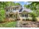 Charming two-story home with stone accents, covered front porch, and mature trees at 500 Mount Pleasant N Rd, Mount Pleasant, NC 28124