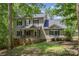 Charming two-story home with stone accents, covered front porch, and mature trees at 500 Mount Pleasant N Rd, Mount Pleasant, NC 28124