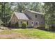 Charming two-story home with a wooden deck, set amongst mature trees and a private backyard at 500 Mount Pleasant N Rd, Mount Pleasant, NC 28124