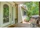 Welcoming front porch with decorative glass door and charming exterior details at 500 Mount Pleasant N Rd, Mount Pleasant, NC 28124