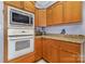 Well-equipped kitchen with built-in microwave, oven, and ample cabinet space at 500 Mount Pleasant N Rd, Mount Pleasant, NC 28124