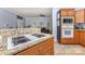 View of the kitchen featuring granite countertops and an open concept to the living area at 500 Mount Pleasant N Rd, Mount Pleasant, NC 28124