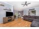 Spacious open-concept living room with hardwood floors and a neutral color palette at 500 Mount Pleasant N Rd, Mount Pleasant, NC 28124