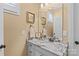 Elegant bathroom vanity featuring a white cabinet, decorative hardware, and a granite countertop and backsplash at 5112 Mill Race Ln, Lancaster, SC 29720