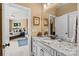 Granite countertop and backsplash, white cabinets with decorative hardware, and adjacent bedroom view at 5112 Mill Race Ln, Lancaster, SC 29720
