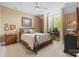 Comfortable bedroom featuring a decorative iron bed frame, neutral tones, and large window for natural light at 5112 Mill Race Ln, Lancaster, SC 29720