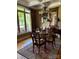 Elegant dining room with hardwood floors, large windows, and stylish lighting at 5112 Mill Race Ln, Lancaster, SC 29720