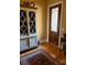 Inviting foyer featuring hardwood floors, detailed door, and decorative cabinet at 5112 Mill Race Ln, Lancaster, SC 29720