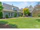 Charming stone house with lush green lawn and meticulous landscaping at 5112 Mill Race Ln, Lancaster, SC 29720