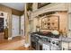 Close up of stove features a tile backsplash, granite counters, and a pot filler at 5112 Mill Race Ln, Lancaster, SC 29720