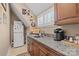 Well-appointed kitchenette featuring granite countertops, wood cabinets, and stainless steel appliances at 5112 Mill Race Ln, Lancaster, SC 29720
