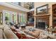 Bright living room boasts a fireplace, large windows, and second story overlook at 5112 Mill Race Ln, Lancaster, SC 29720