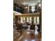 Grand living room with soaring ceilings, abundant natural light, and elegant hardwood floors at 5112 Mill Race Ln, Lancaster, SC 29720