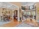Spacious living area featuring hardwood floors, staircase, and coffered ceilings at 5112 Mill Race Ln, Lancaster, SC 29720