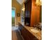 A full bathroom with double sinks, granite countertops, and full cabinets at 5112 Mill Race Ln, Lancaster, SC 29720