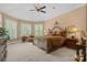 Bright main bedroom with vaulted ceilings, fan, carpet, and large windows with shutters at 5112 Mill Race Ln, Lancaster, SC 29720