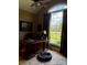 Well-lit office with large window, hardwood floors, and a cozy pet bed at 5112 Mill Race Ln, Lancaster, SC 29720