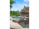 Backyard pool and hot tub with ample lounge seating at 5112 Mill Race Ln, Lancaster, SC 29720