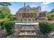 A stunning outdoor oasis featuring a sparkling pool, elegant patio furniture, and a well-manicured garden at 5112 Mill Race Ln, Lancaster, SC 29720