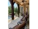 Covered porch featuring comfortable seating and views of the landscaped backyard at 5112 Mill Race Ln, Lancaster, SC 29720