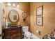 Classic powder room with decorative mirror, unique sink, and warm neutral paint at 5112 Mill Race Ln, Lancaster, SC 29720