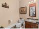 Cozy powder room with a decorative mirror and accents at 5112 Mill Race Ln, Lancaster, SC 29720