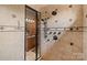 Elegant shower with tile walls, glass door, and multiple shower heads and hardware at 5112 Mill Race Ln, Lancaster, SC 29720