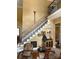 Elegant staircase with wrought iron railings and hardwood steps, leading to the second floor at 5112 Mill Race Ln, Lancaster, SC 29720