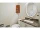 Bathroom with granite countertop, white cabinetry, medicine cabinet, and brushed nickel faucet at 5229 Milford Rd, Charlotte, NC 28210