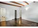 This light-filled bedroom features hardwood floors, a closet, and neutral walls at 5229 Milford Rd, Charlotte, NC 28210