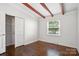 Bedroom featuring hardwood floors, a window and closet at 5229 Milford Rd, Charlotte, NC 28210